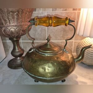 Vintage or Antique Tea Kettle made of Solid Brass, featuring distinct small feet
